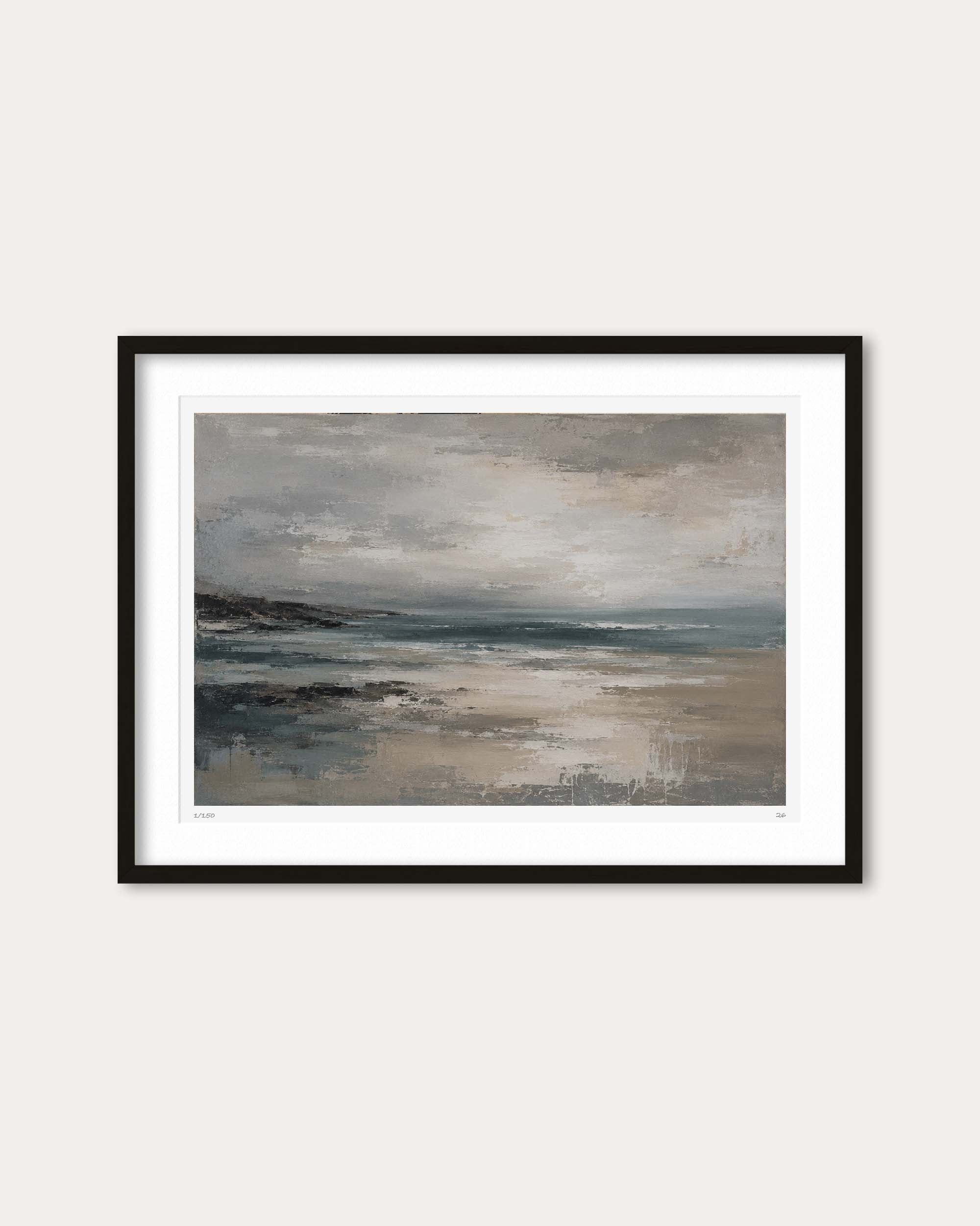 A framed landscape art print featuring an abstract depiction of a misty beach or coastal scene in muted gray, beige, and blue tones, presented with a white mat and a thin black frame against a light beige wall.