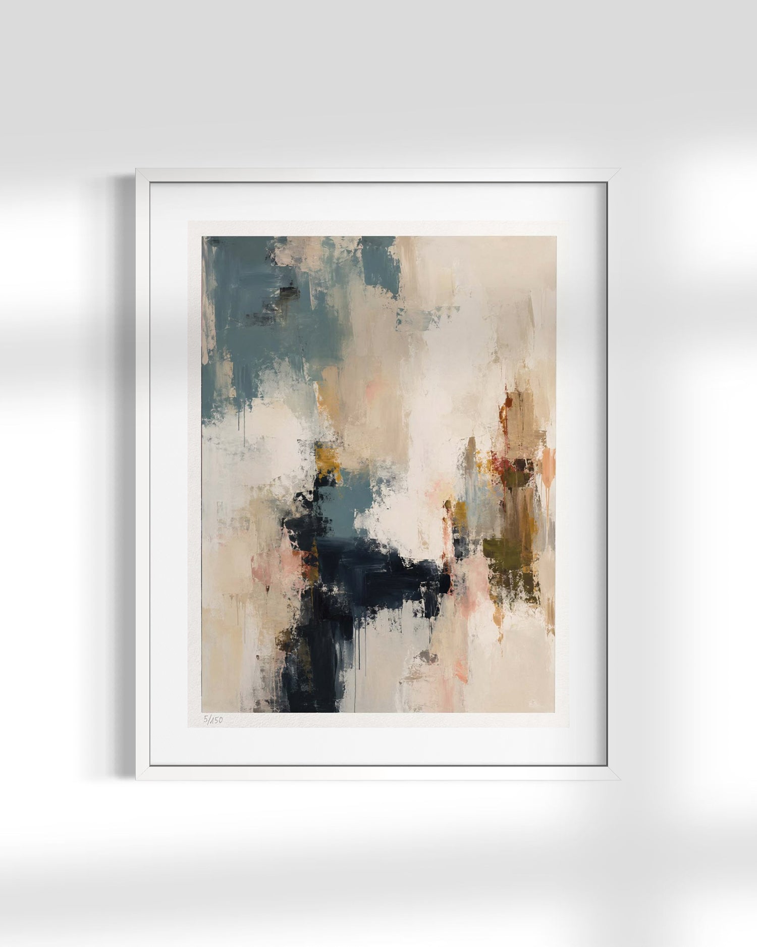 A framed abstract art print featuring textured brushstrokes in beige, slate blue, charcoal, and soft terracotta tones, displayed against a light gray wall with soft shadows.