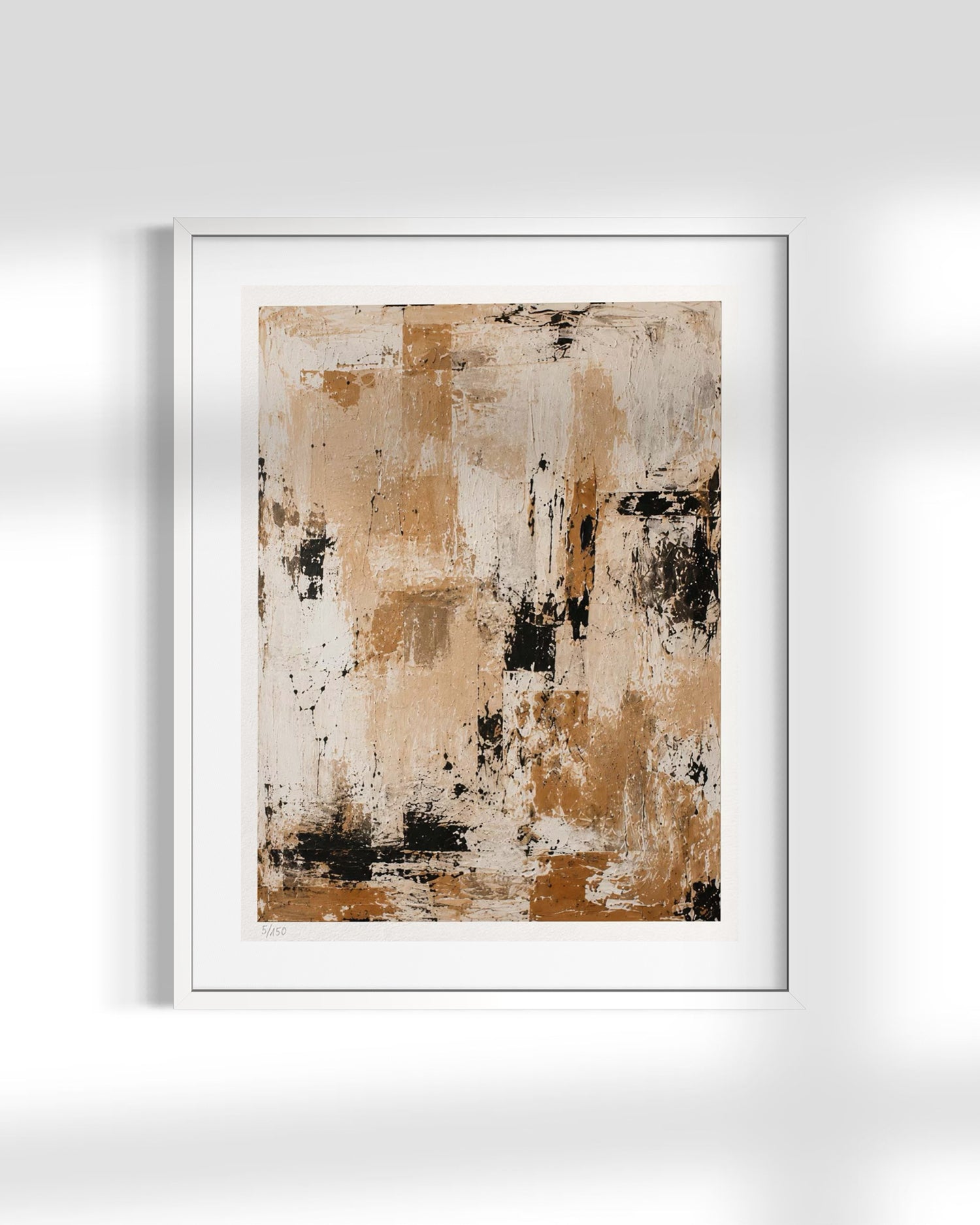A framed abstract art print featuring textured brushstrokes in beige, brown, white, and black, presented in a white frame against a light gray wall with soft shadows.