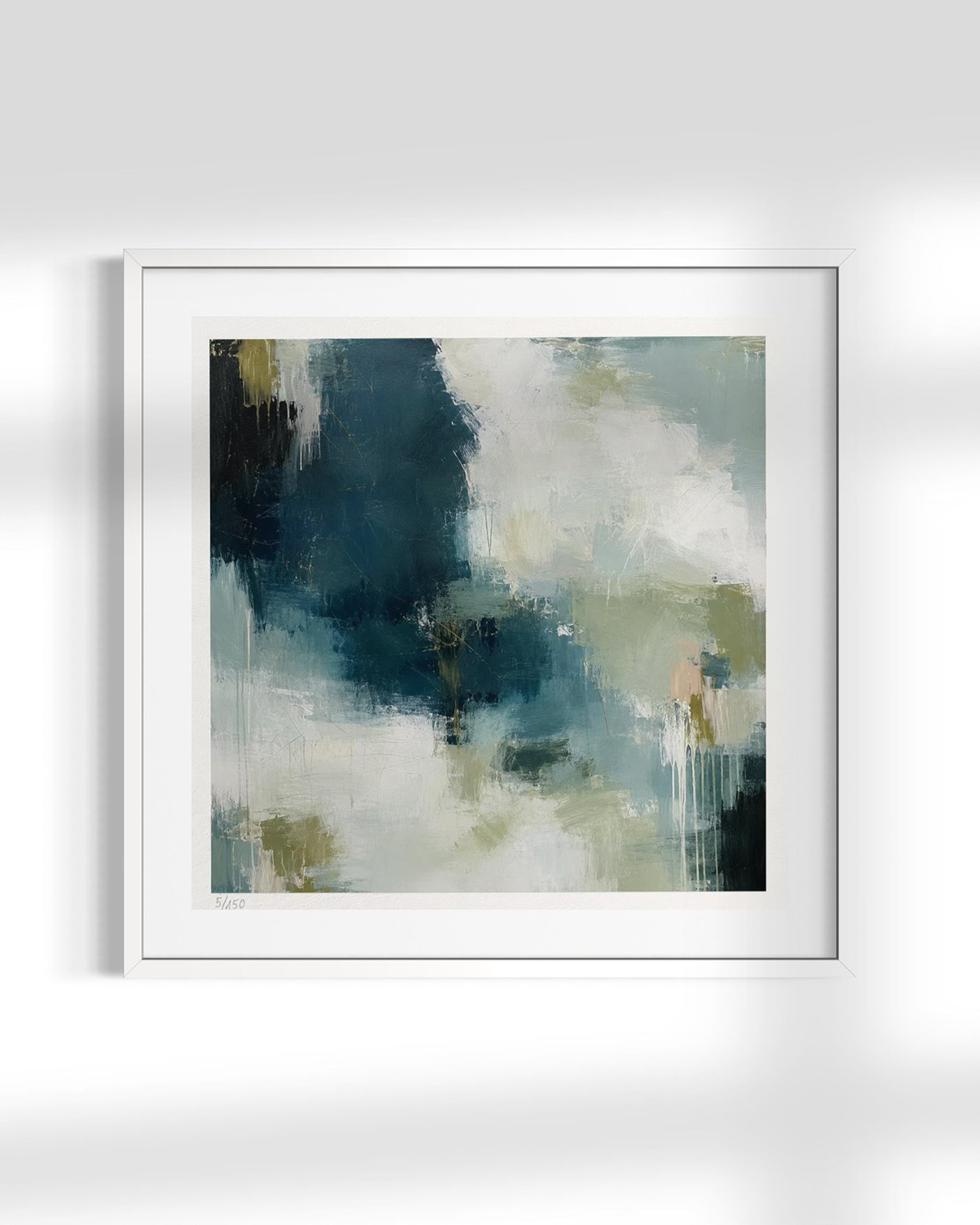 A framed abstract art print featuring a textured, painterly composition in shades of navy, teal, cream, and soft olive green, presented in a clean white frame against a light gray wall.