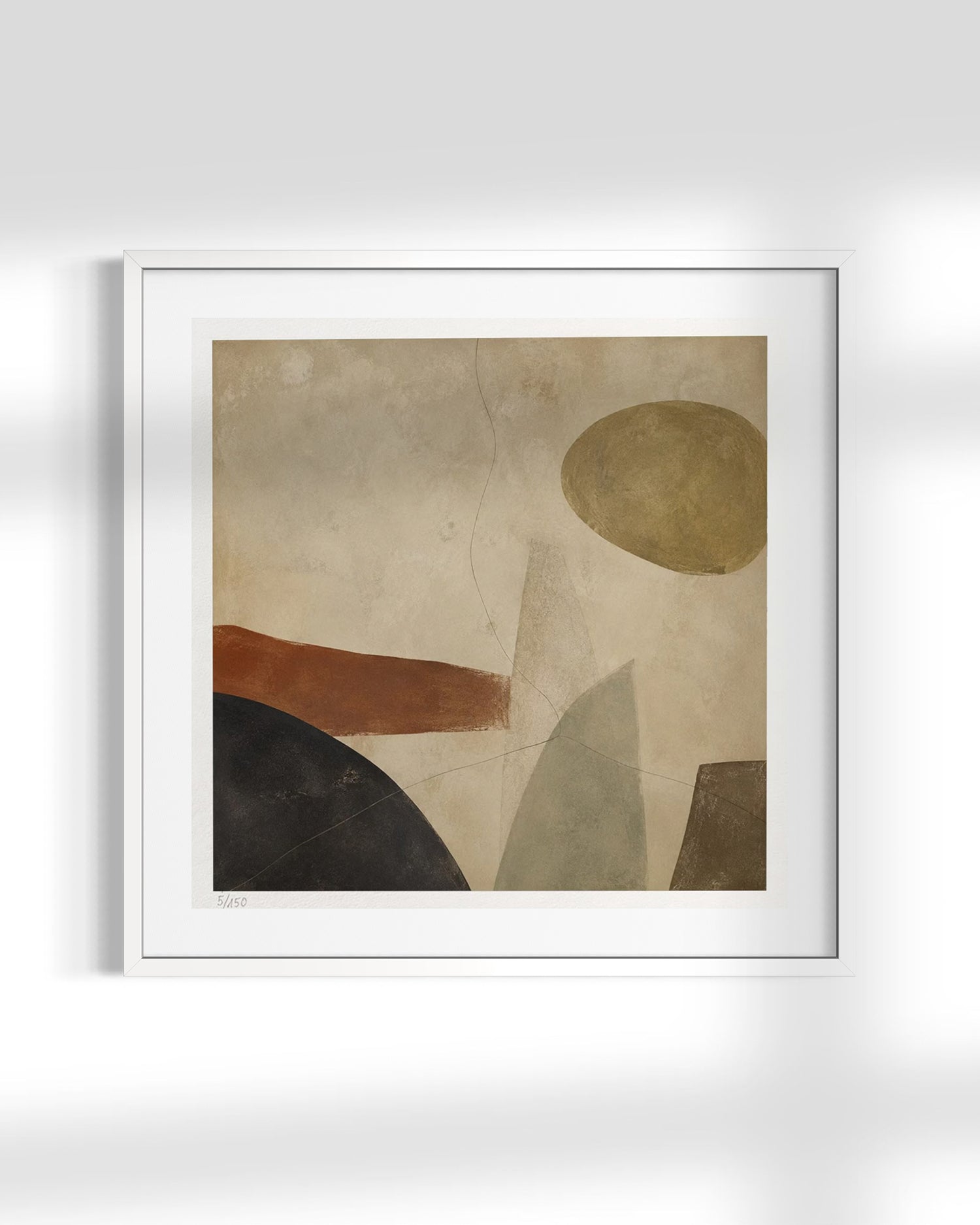 A framed abstract art print featuring geometric shapes in beige, brown, black, and muted green on a textured background, presented in a white frame against a light gray wall.