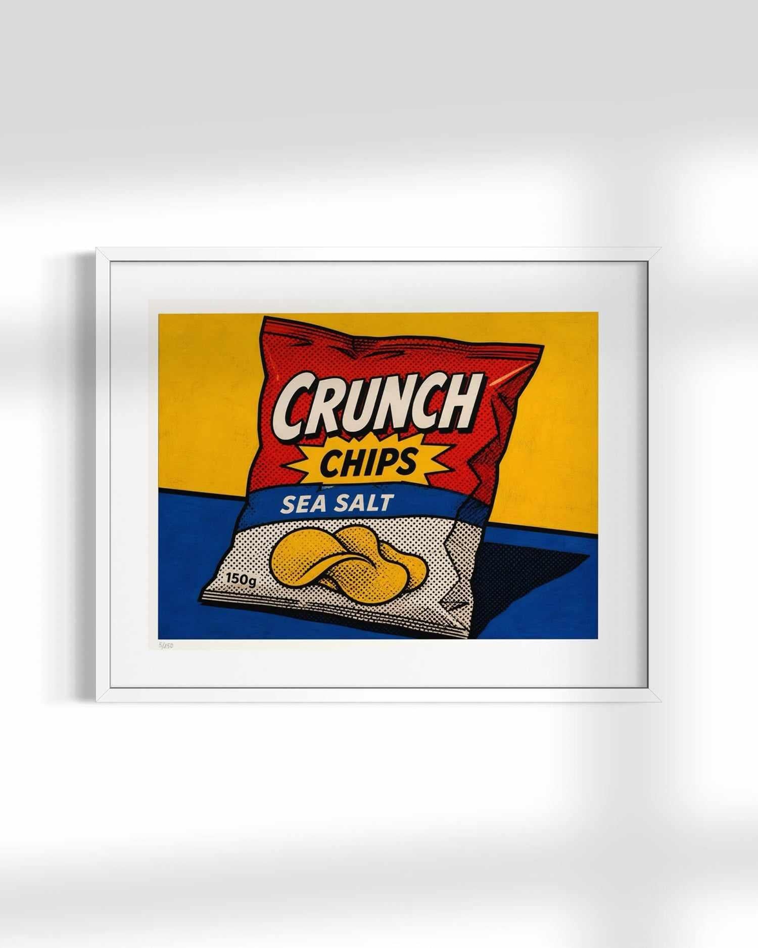 A framed pop-art style print of a Crunch Chips Sea Salt bag, shown against a light gray wall with soft shadows.