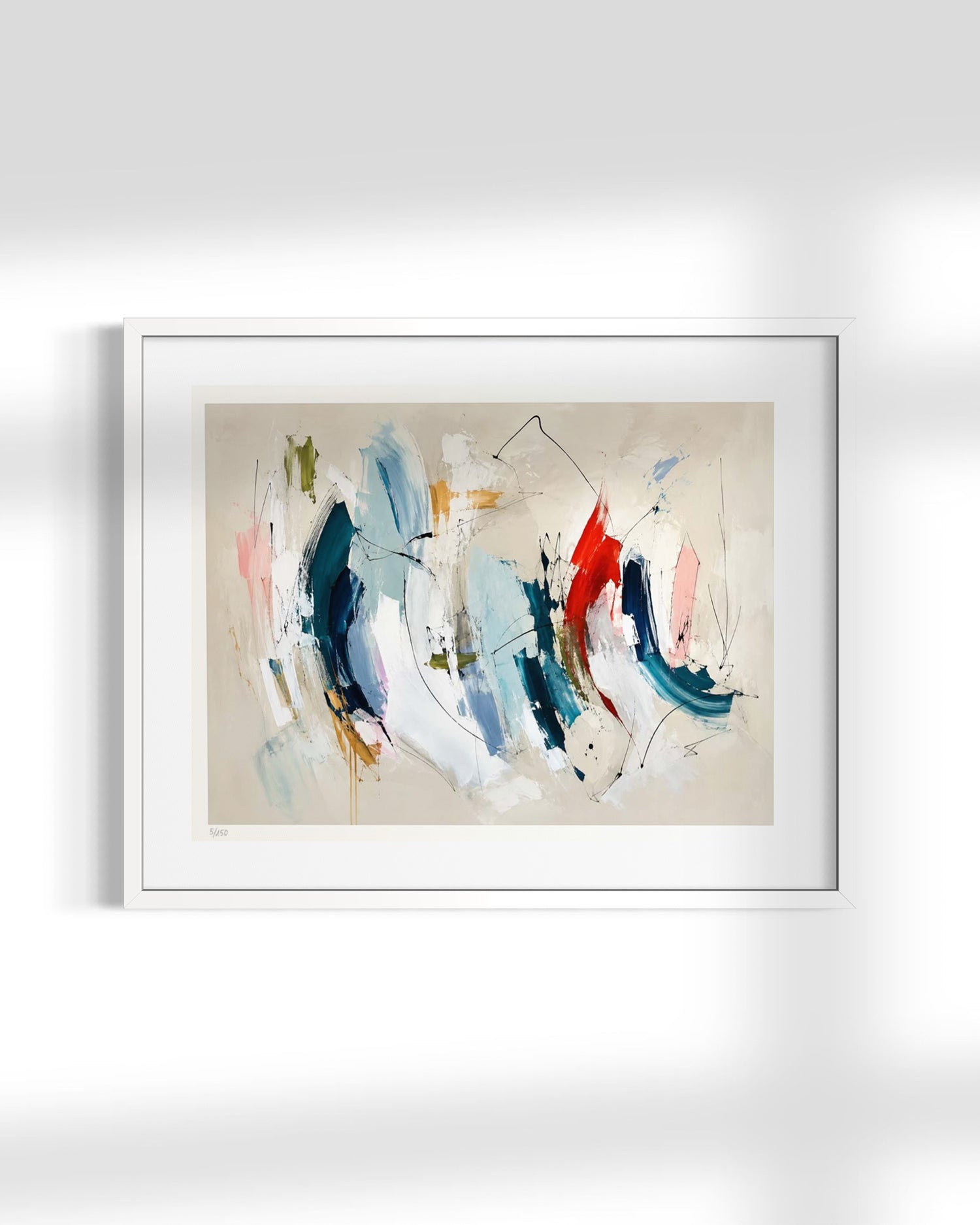 A framed abstract canvas print featuring expressive brushstrokes in blue, red, white, and beige, displayed on a light gray wall with soft shadows.