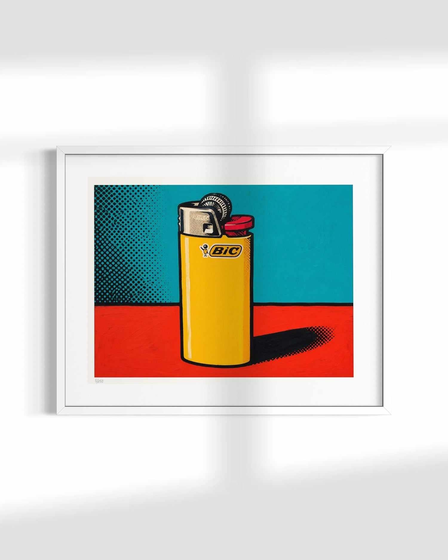 A framed pop-art style print featuring a yellow BIC lighter on a red and teal background, displayed against a white wall with soft shadow overlays.
