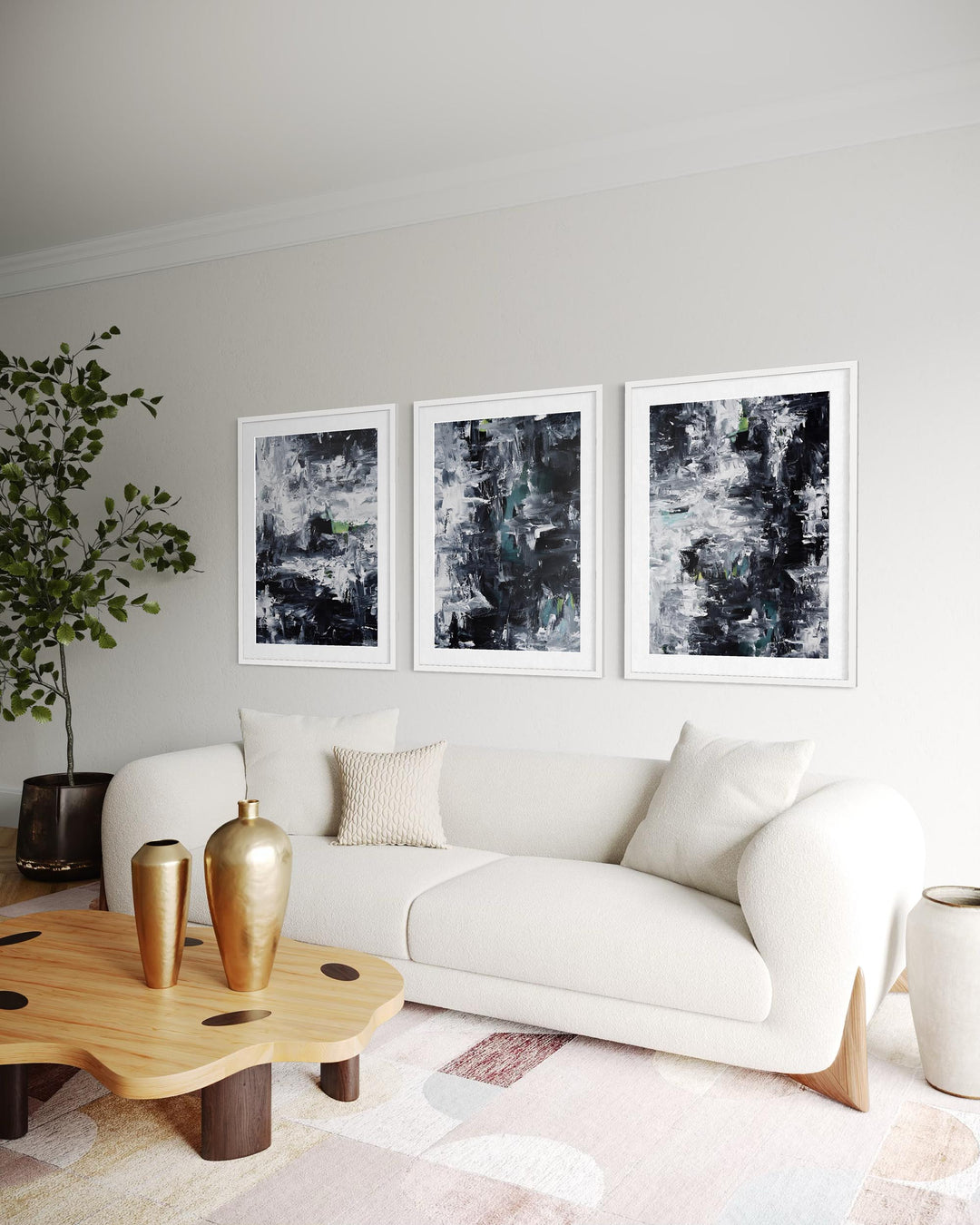 Modern living room with a white sofa, wooden coffee table, and abstract art on the wall.