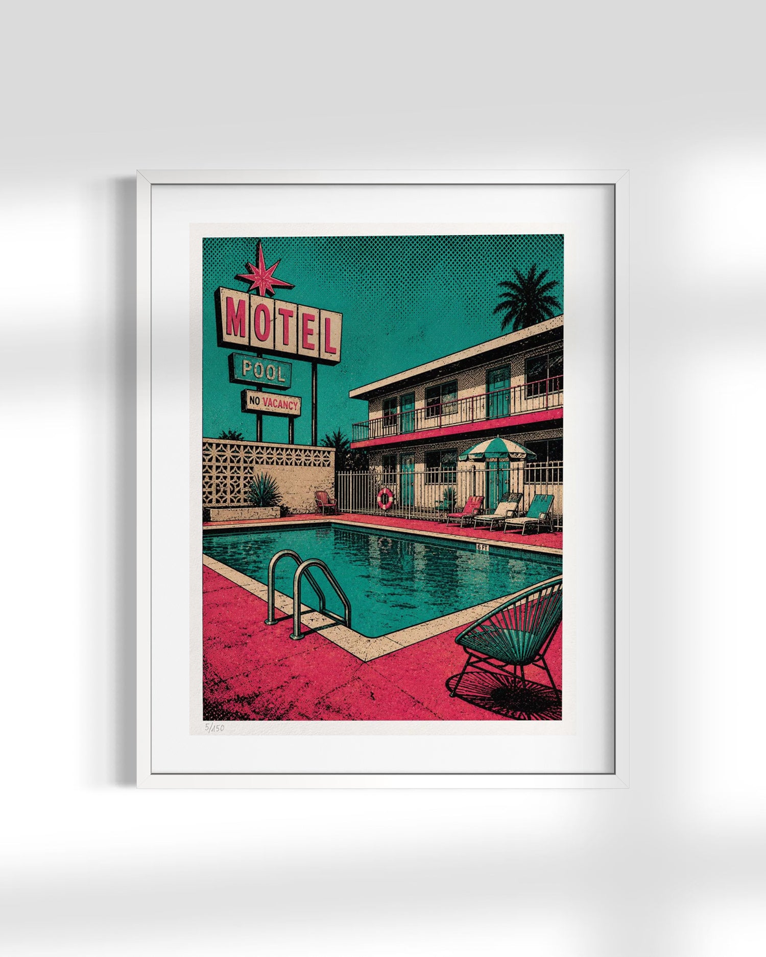 A framed retro-style art print depicting a mid-century motel pool scene with a turquoise sky, pink pool deck, teal building, and neon motel sign, shown against a light gray wall.