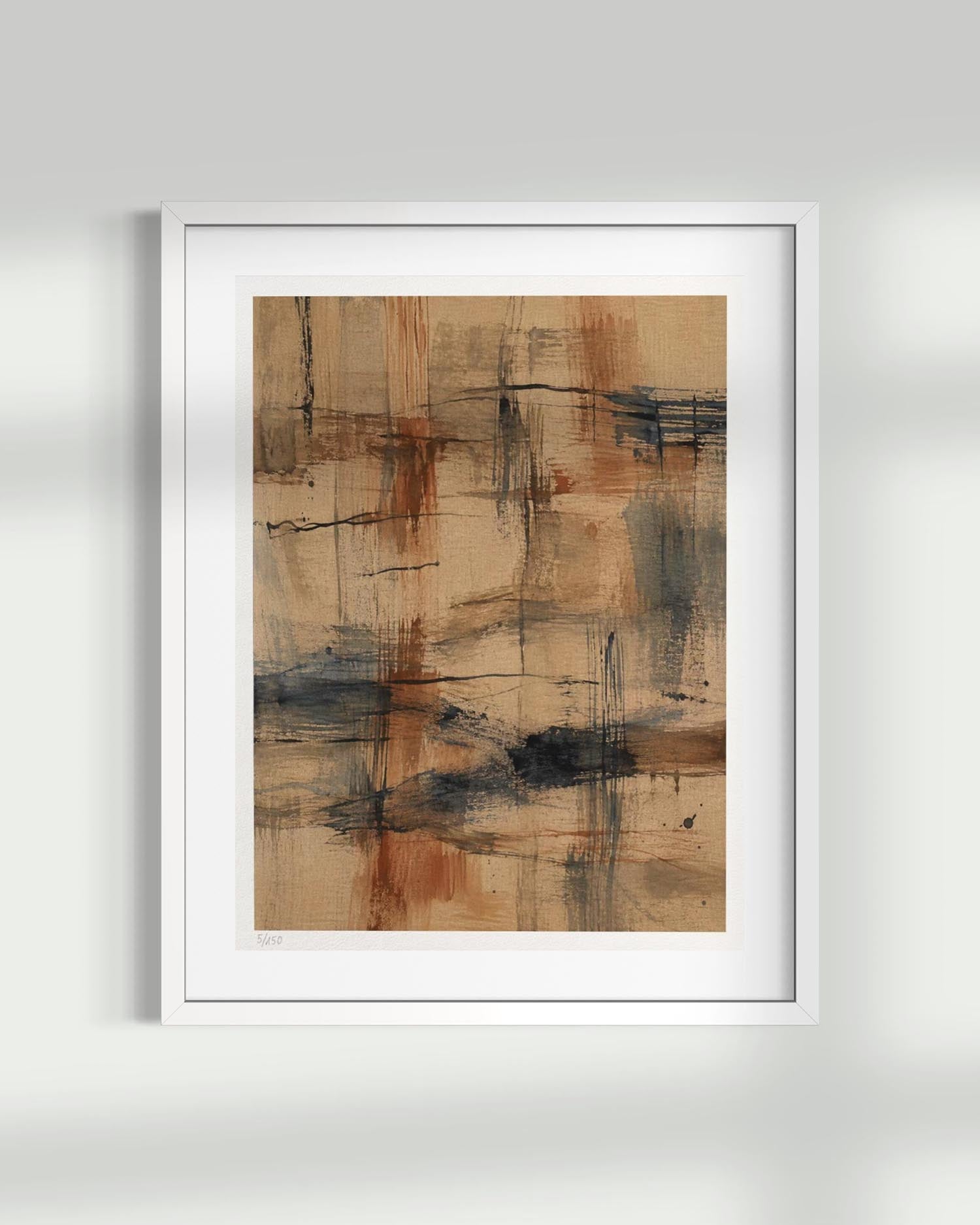 A framed abstract art print featuring textured brushstrokes in beige, brown, orange, and dark blue-gray tones, presented in a white frame against a light gray wall.