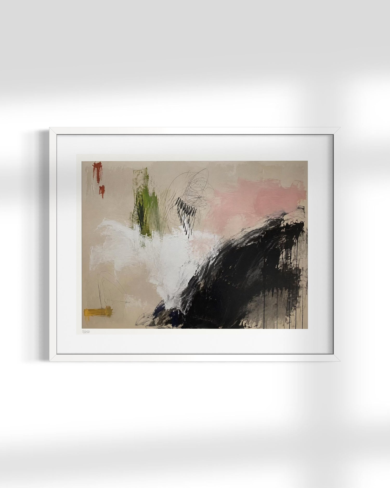A framed abstract painting with a white mat and white frame, hanging on a light gray wall. The artwork features a beige background with a large black brushstroke, soft pink and white washes, and small green and red accents.